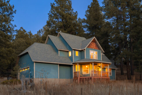 Front of the home for rent - 2 story with a covered front porch and a large yard.